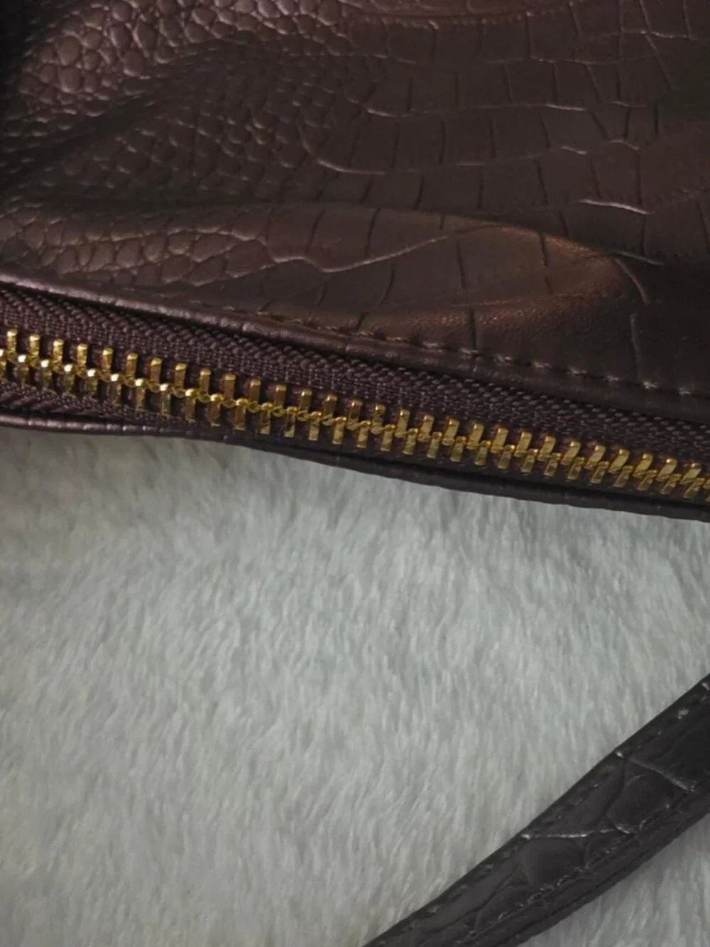 Burgundy crocodile textured leather crossbody bag with gold hardware
